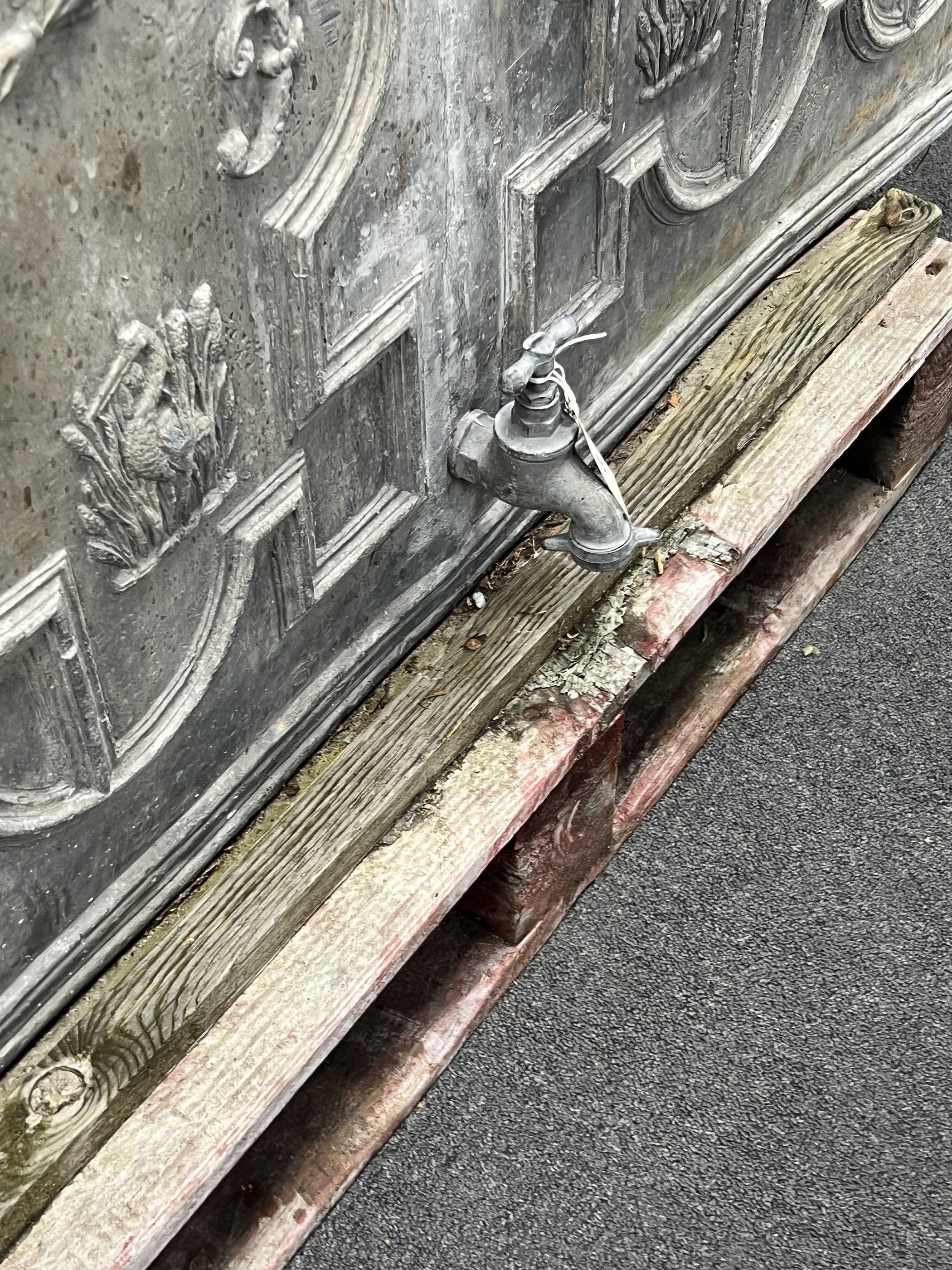 A George II lead cistern dated 1752 and initialled FM, later tap, sides and back, width 149cm, depth 50cm, height 90cm